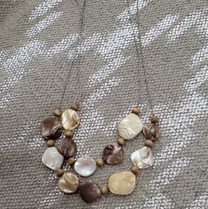 Shell necklace double strand 18" browns cream carmel colors, silver chain